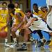Pioneer senior Aedan York and Ypsilanti freshman Corey Allen drives reach for a loose ball on Monday March 4. Daniel Brenner I AnnArbor.com